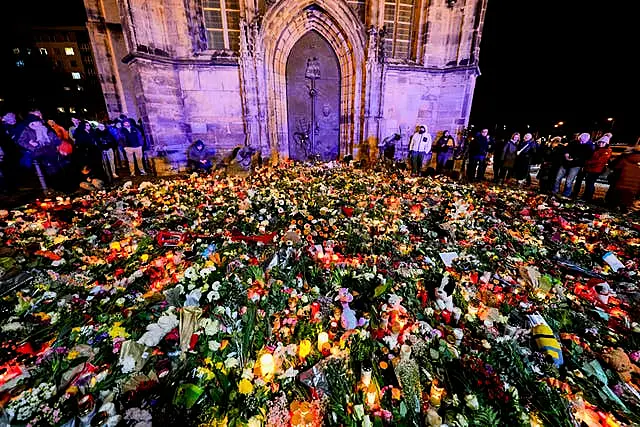 Flowers laid near site of market attack