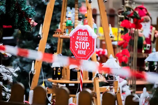 'Santa please stop here' is written on a sign behind a police cordon at the Christmas market in Magdeburg