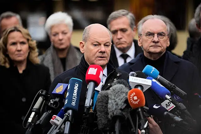 German Chancellor Olaf Scholz speaks to journalists on Saturday at the Magdeburg Christmas market.