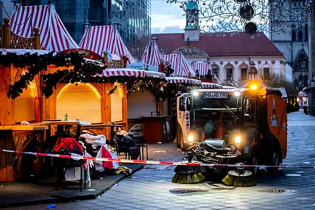 Clean-up truck at work in a Christmas market