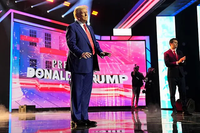 President-elect Donald Trump arrives to speak at AmericaFest in Phoenix, Arizona