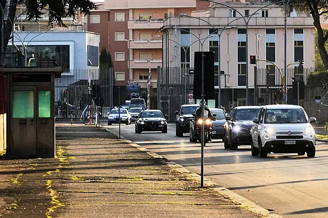 The motorcade escorting Pope Francis arrives at Rebibbia prison