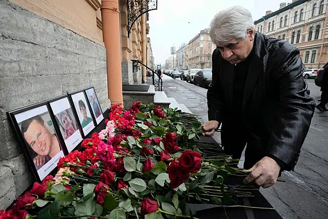 The head of the Azerbaijani diaspora in St Petersburg, Vagif Mamishev, lays flowers at the consulate of Azerbaijan