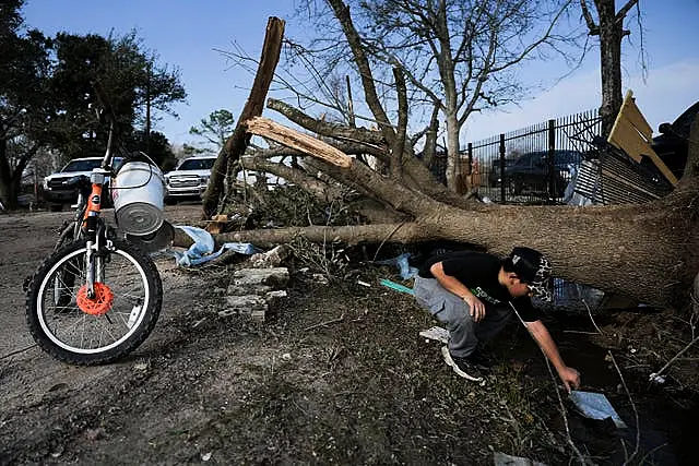 JC Betanzos, 11, looks for items from his sister’s business