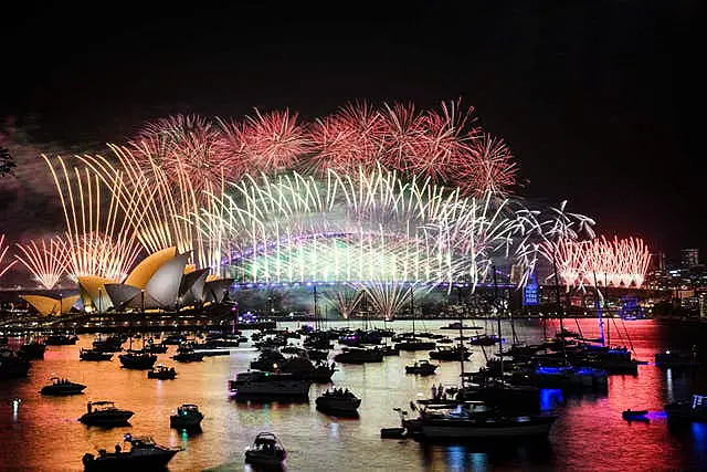 Fireworks explode over the Sydney Opera House and Harbour Bridge during New Year’s Eve celebrations in Sydney 