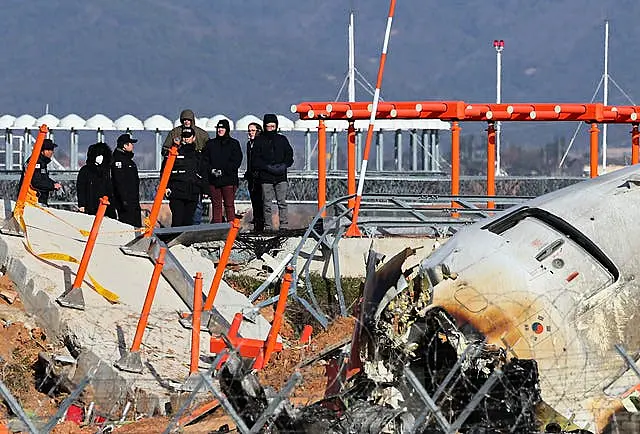 Experts at a crash site