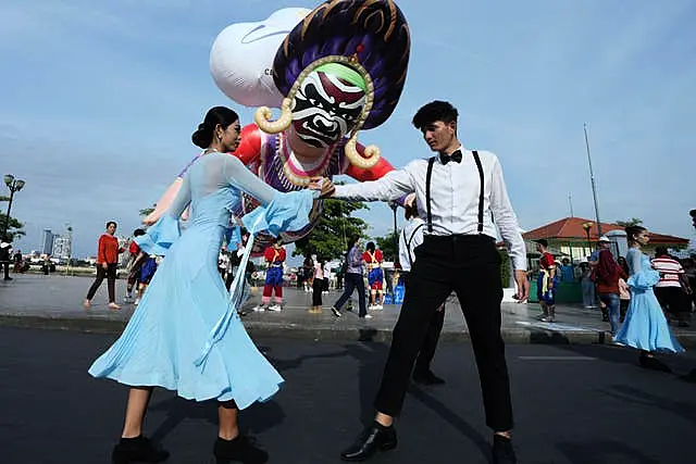 Cambodian dancers perform during the Celebrating Cambodia event as part of New Year’s Eve in front of the Royal Palace in Phnom Penh