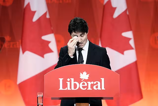 Prime Minister Justin Trudeau wipes away tears
