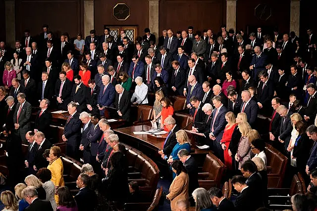 Members bow their heads during a moment of silence for the victims of the attack in New Orleans as the House of Representatives meets to elect a speaker and convene the new 119th Congress at the Capitol in Washington 