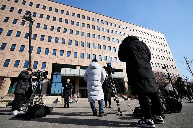 Media members wait for the arrival of impeached South Korean President Yoon Suk Yeol near the Corruption Investigation Office for High-ranking Officials in Gwacheon