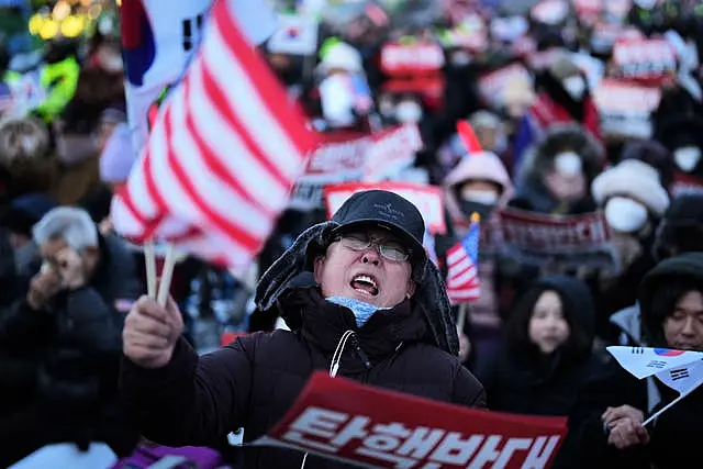 Supporters of impeached South Korean President Yoon Suk Yeol stage a rally to oppose a court warrant for his arrest