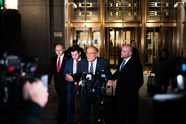 Rudy Giuliani speaks to the media outside of Manhattan federal court 