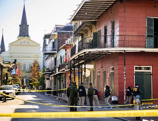 The FBI investigates the area on Orleans St and Bourbon Street by St Louis Cathedral in the French Quarter where a suspicious package was detonated after a person drove a truck into a crowd earlier on Bourbon Street 