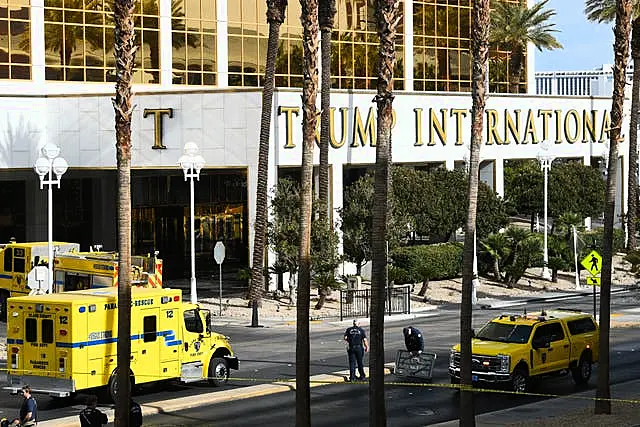 Fire crews work outside Trump International Hotel in Las Vegas after the fire and explosion of a Tesla Cybertruck