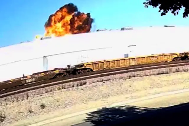 This image taken from video, shows an explosive fire as a small plane crashes into a commercial building in Fullerton 