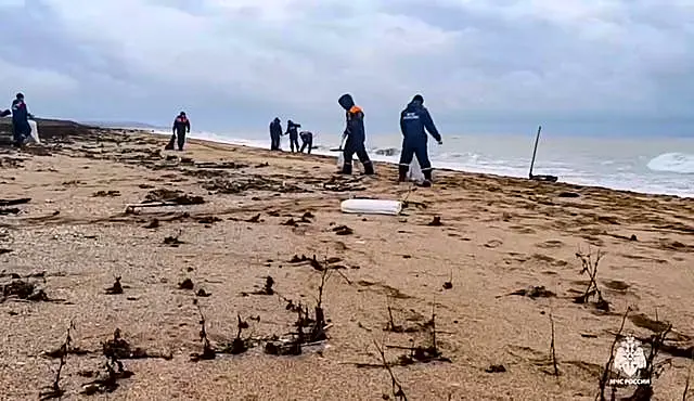 Volunteers work on the beach