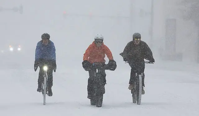 A group of cyclists make way through downtown Wichita