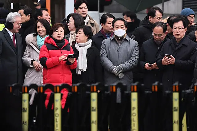 Members of the ruling People Power Party wait for the arrival of investigators from the Corruption Investigation Office for High-ranking Officials