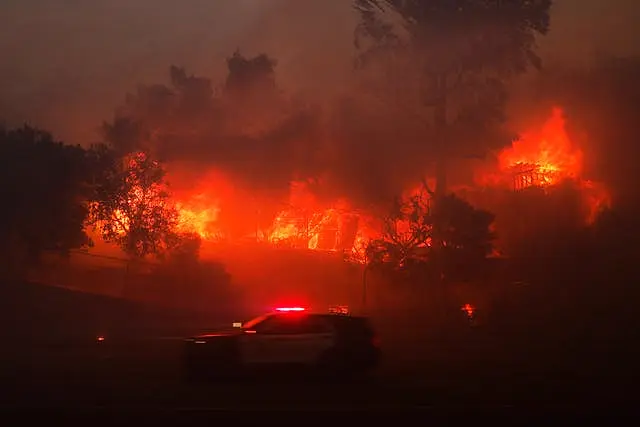 The Palisades Fire burns a property in the Pacific Palisades neighborhood of Los Angeles