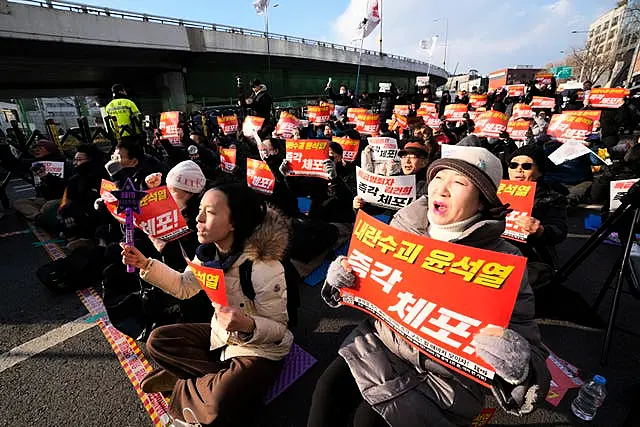 Protesters attend a rally demanding the arrest of impeached South Korean President Yoon Suk Yeol 