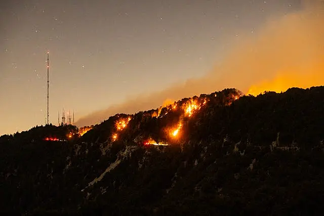 Spots of the Eaton Fire still burn after the fire swept through the mountains of the Angeles National Forest