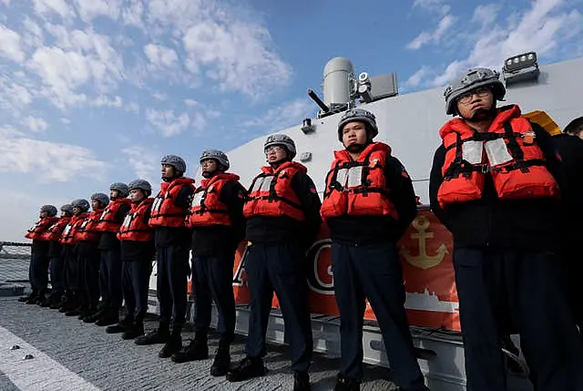 Deck crew of Taiwanese navy stand by on a Tuo Chiang patrol ship during a simulated attack drill 