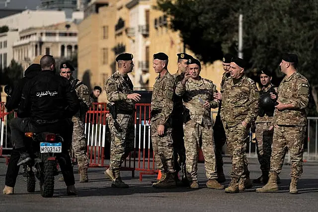 Lebanese army soldiers block a road that leads to the parliament building in Beirut 