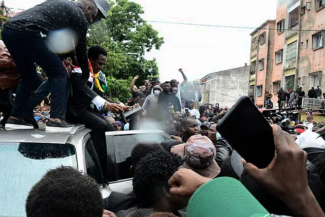 Mozambique’s opposition leader Venancio Mondlane addresses supporters from the top of a vehicle on the street in Maputo, Mozambique