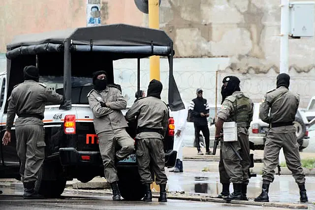 Mozambique’s special forces members deployed to guard opposition leader Venancio Mondlane as he addresses his supporters on the street in Maputo, Mozambique