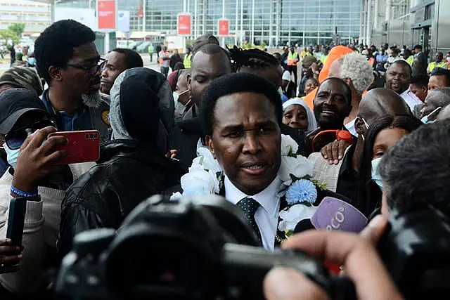 Mozambique’s opposition leader Venancio Mondlane speaks to journalist on arrival at the Mavalane International Airport in Maputo, Mozambique