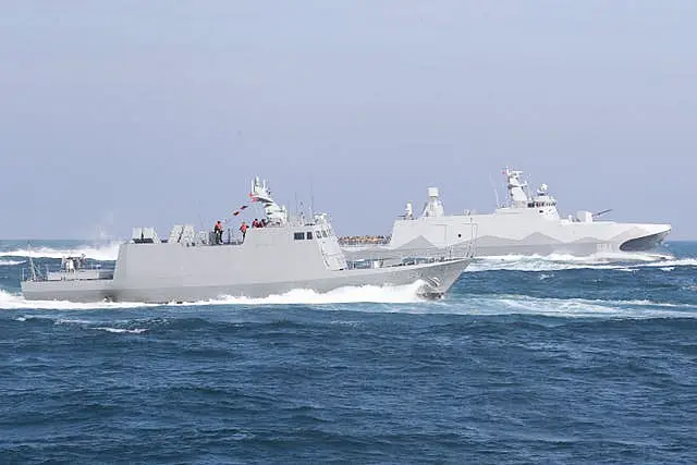 A Tuo Chiang patrol ship and a Kuang Hua VI-class missile boat during a simulated attack drill 