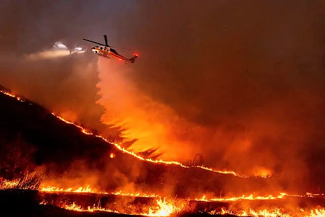 Water is dropped by helicopter on the Kenneth Fire in the West Hills section of Los Angeles 