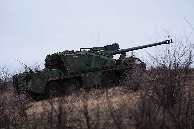 A Ukrainian self-propelled howitzer Dita of Azov brigade rides to firing position on the frontline