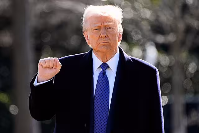 Donald Trump with one fist lifted