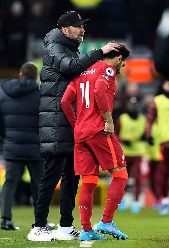 Liverpool manager Jurgen Klopp consoles Mohamed Salah
