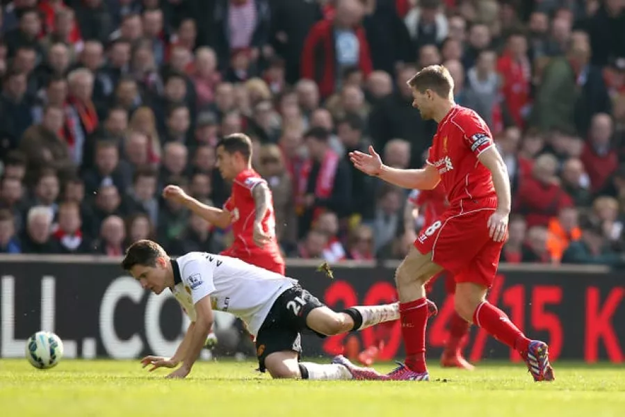 Manchester United’s Ander Herrera is fouled by Liverpool’s Steven Gerrard