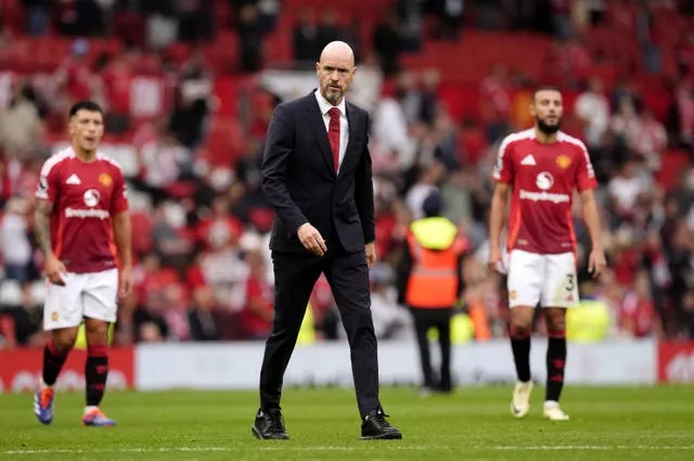 Manchester United manager Erik ten Hag walks off dejected 