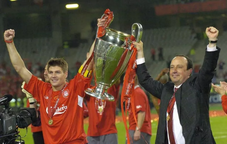 Benitez (right) remains a revered figure at rivals Liverpool
