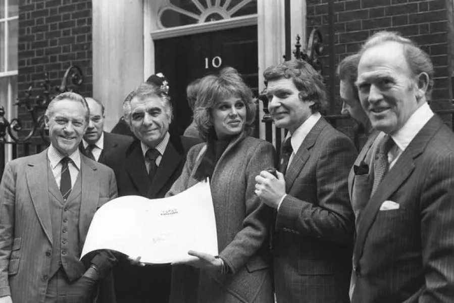 (l-r) Richard Todd, Sir Geraint Evans, Joanna Lumley, Derren Nesbett, Roy Dotrice and Gordon Jackson outside 10 Downing Street, where they handed in a letter expressing their sadness at the closure of the D’Oyly Carte Opera Company. The company has been performing the works of Gilbert and Sullivan for 106 years.