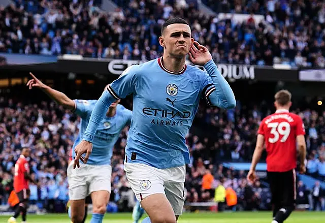 Phil Foden celebrates scoring against Manchester United