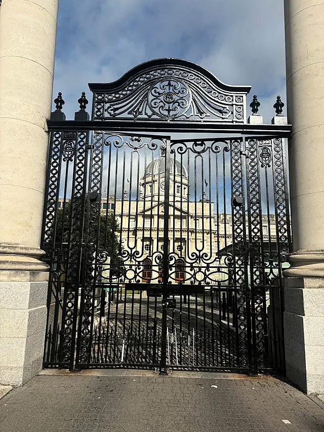 Damage at the bottom of large black gates