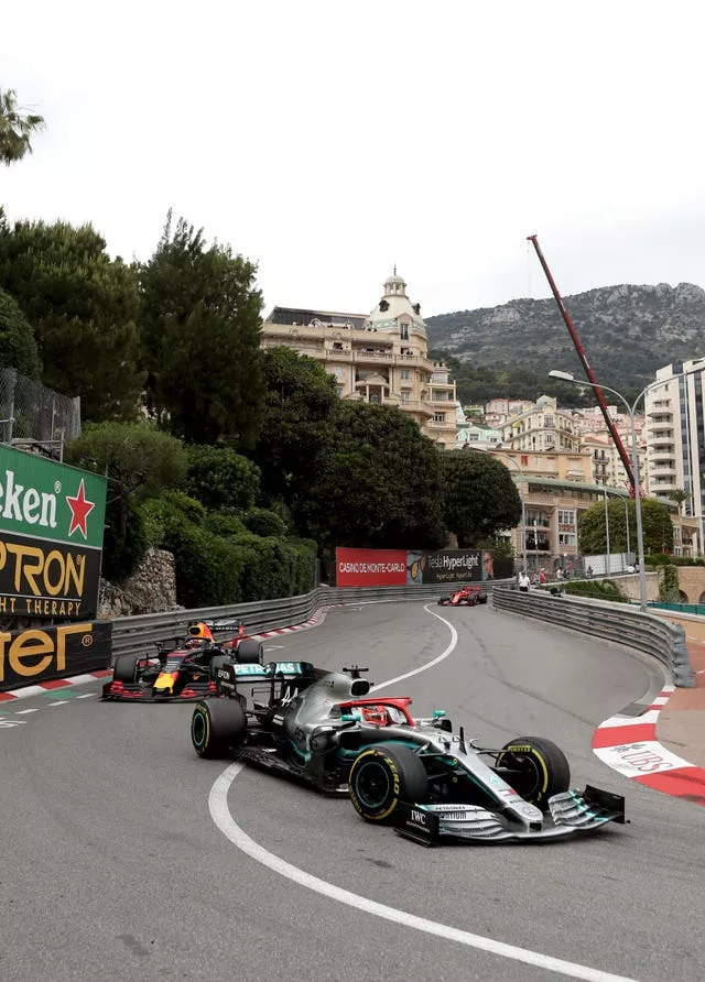 Mercedes’ Lewis Hamilton, right, leads from Red Bull’s Max Verstappen into the Fairmont Hairpin during the 2019 Monaco Grand Prix
