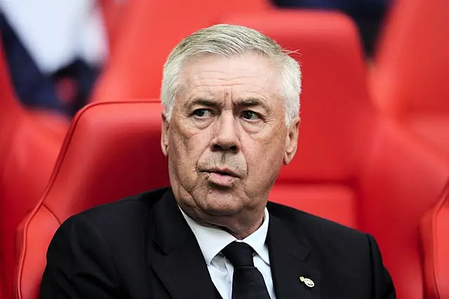 Real Madrid manager Carlo Ancelott sits in the dugout