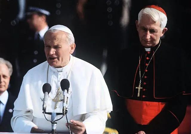 Pope John Paul II, left, makes a speech on his arrival at Gatwick Airport on the first day of his visit to Britain in 1982