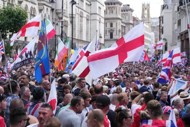 People take part in a protest march in central London organised by Tommy Robinson (Maja Smiejkowska/PA)