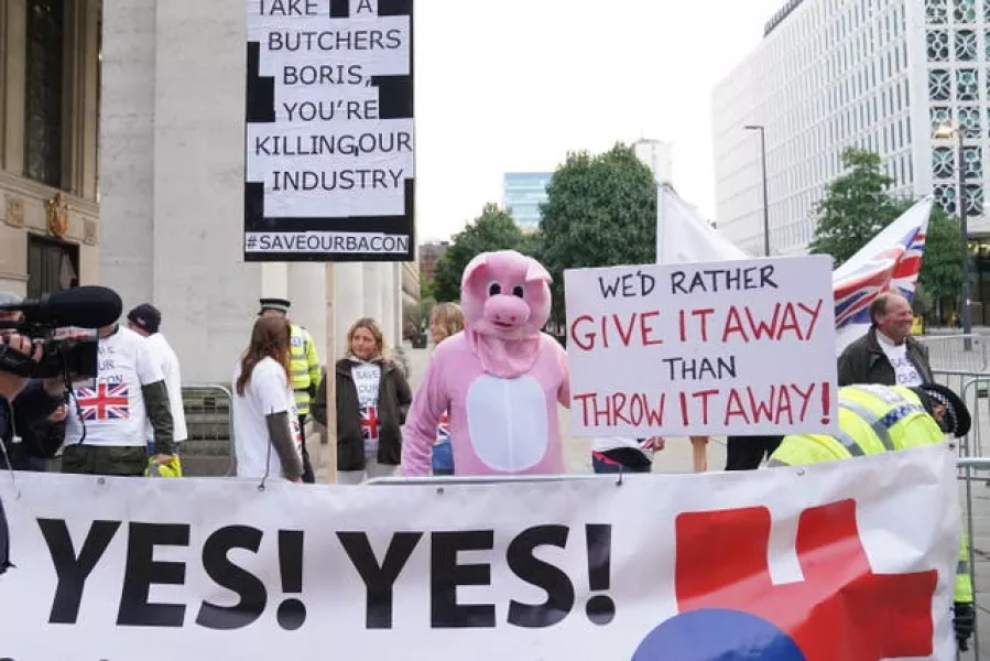 Pig farmers protesting outside the Conservative Party Conference in Manchester