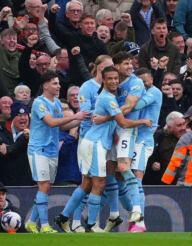 Manchester City’s John Stones (second right) celebrates scoring against Liverpool