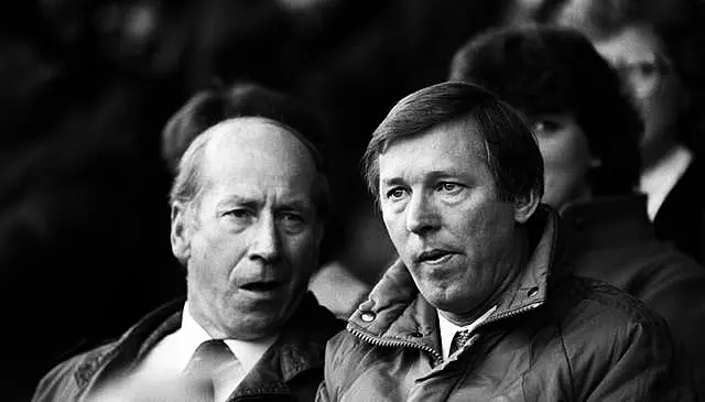 Sir Alex Ferguson alongside former Manchester United forward Sir Bobby Charlton, left, early in his reign