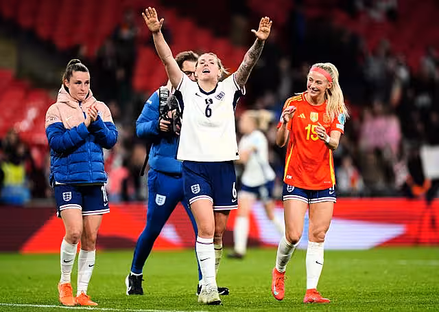 England defender Millie Bright, centre, celebrates with team-mates after the final whistle