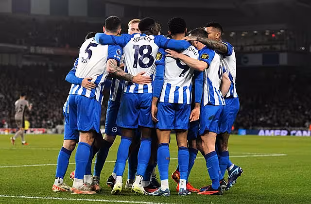 Brighton celebrate their second goal, scored by Joao Pedro